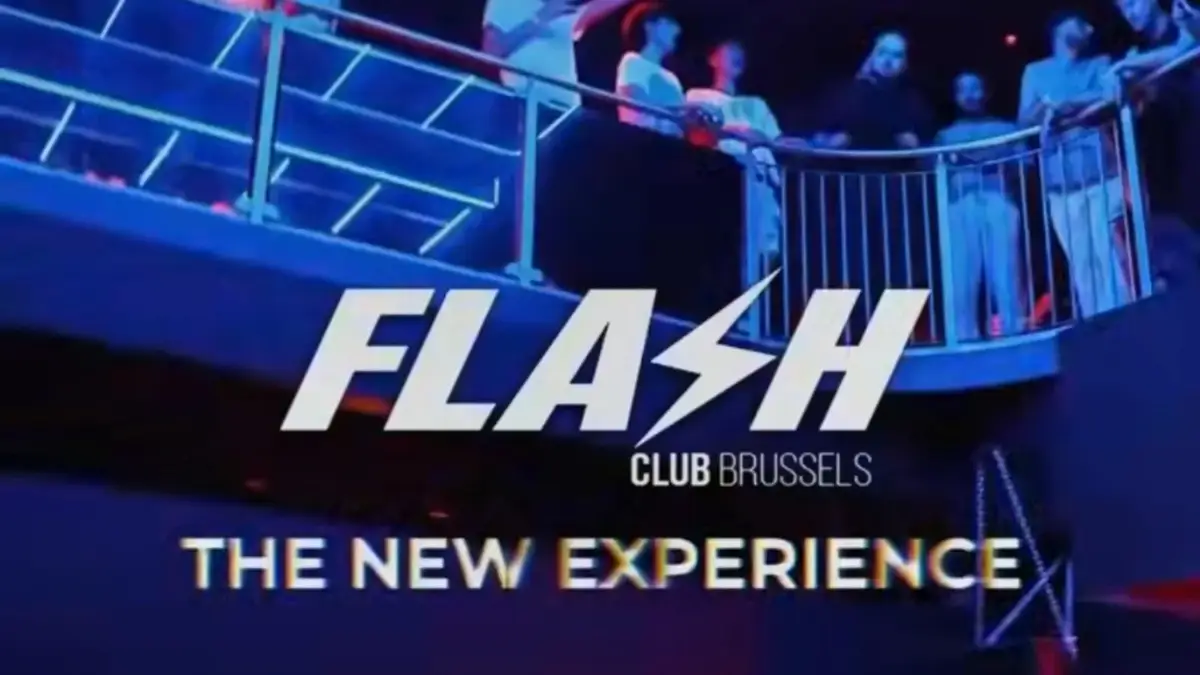 Official Flash Club Brussels visual “The New Experience”: blue-lit mezzanine with a party crowd